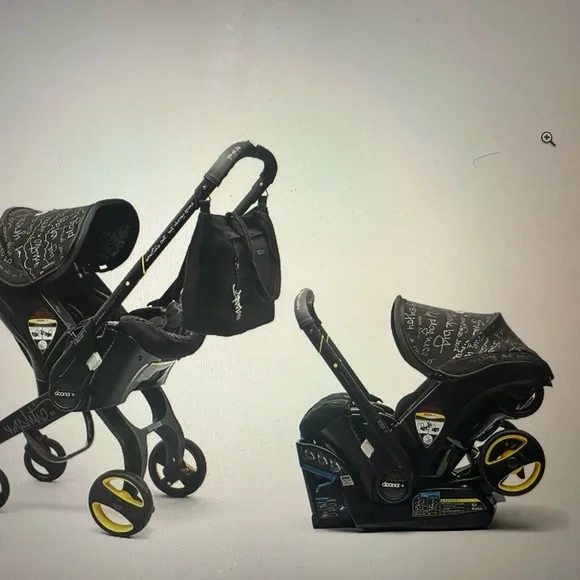 Doona Infant Car Seat & Stroller in Black with Yellow Accents - Picture 1 of 9